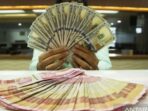 Photo by antaranews.com - Perbedaan Tabungan Valuta Asing Dollar vs Rekening Rupiah Biasa
